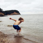Clavert Cliffs with child playing in water