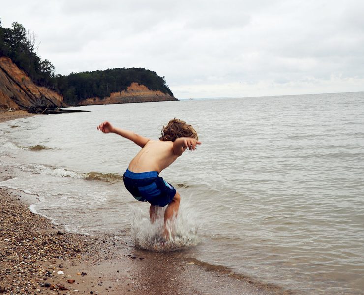 Clavert Cliffs with child playing in water