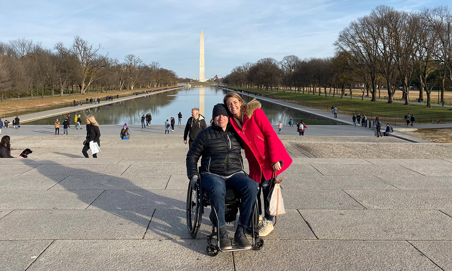 Man in wheelchair with smiling woman