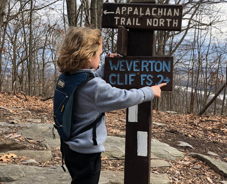 Child at Trail Sign