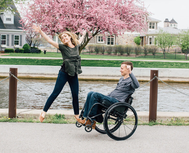 Young Couple Jumping, Man in Wheelchair, Woman on foot