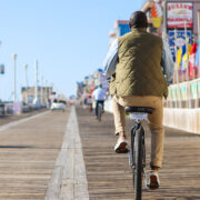 Man riding on a bike on the OCMD Boardwalk