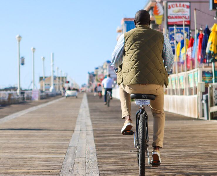 Man riding on a bike on the OCMD Boardwalk