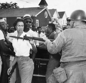 Gloria Richardson and protestors facing National Guard troops, Cambridge, Maryland, ca. 1963