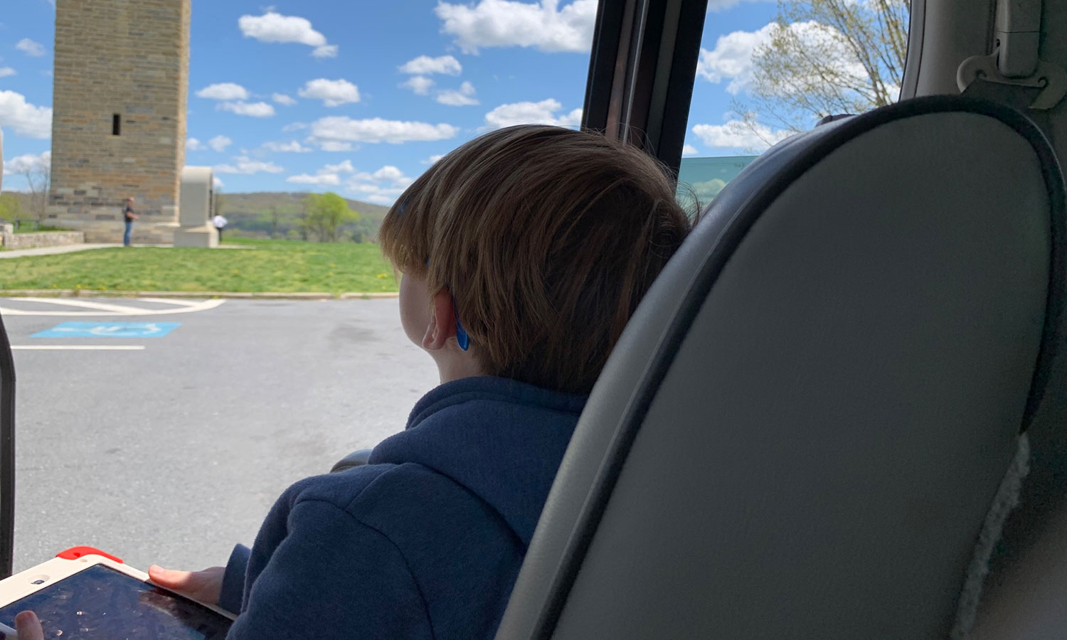 Child in a car looking at the tower
