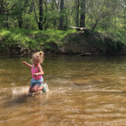 Child dancing in the water