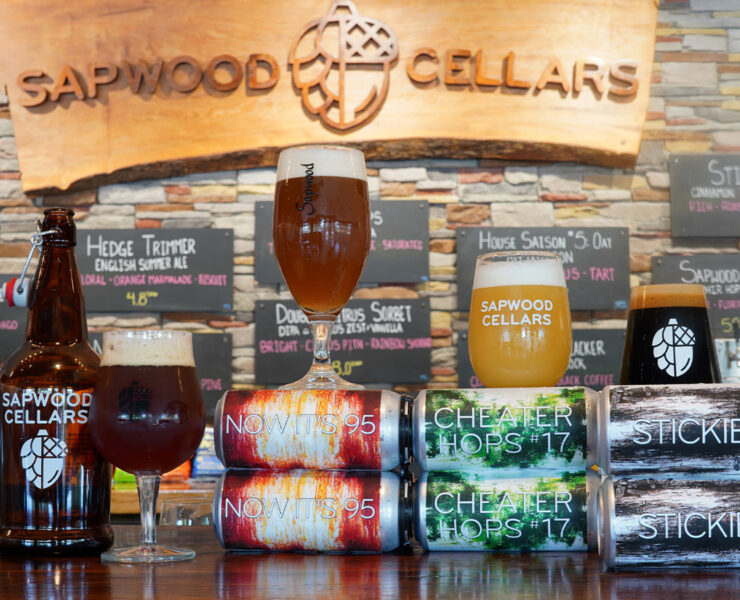 Sapwood Cellars Brewery with beer cans all lined up