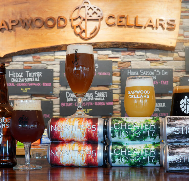 Sapwood Cellars Brewery with beer cans all lined up