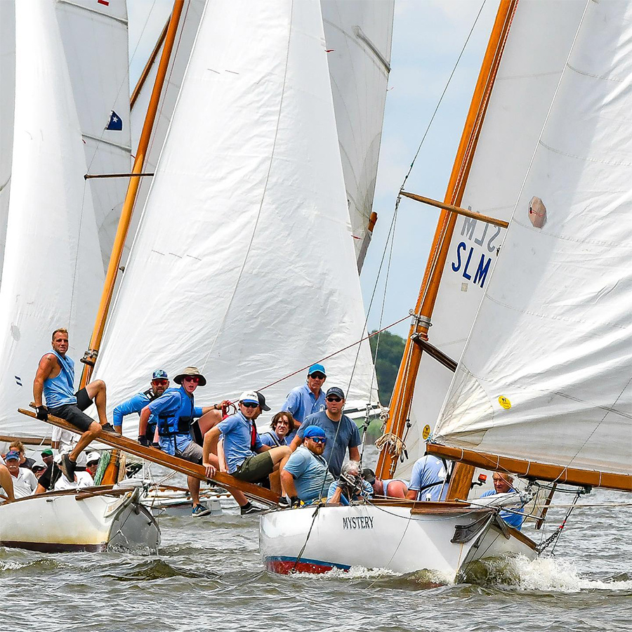 A group of people on sailboads