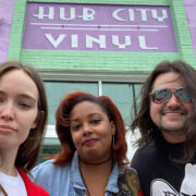 Three friends outside of Hub City Vinyl