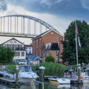 Boats in the water with the bridge in the background