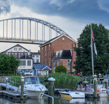 Boats in the water with the bridge in the background