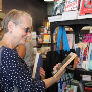 Woman looking at books in a bookstore