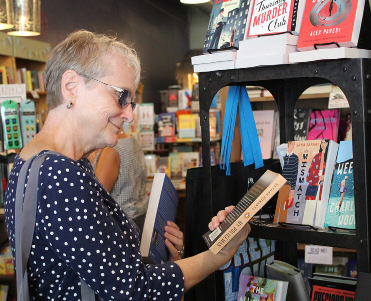 Woman looking at books in a bookstore