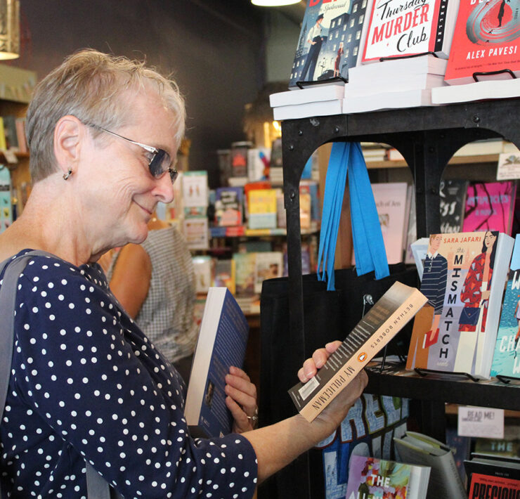 Woman looking at books in a bookstore
