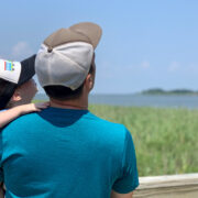 Father and Son look at the beach