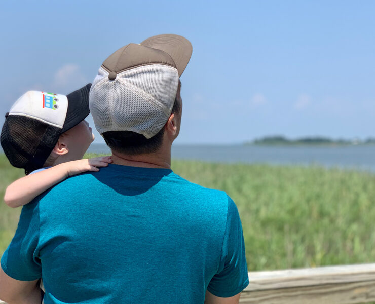Father and Son look at the beach