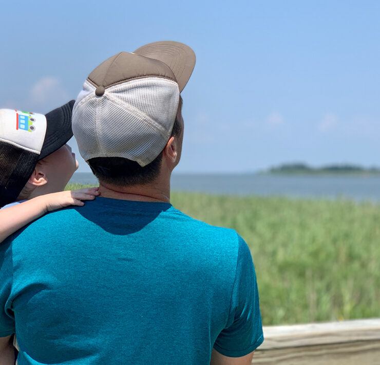 Father and Son look at the beach