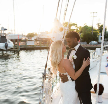A couple kissing on a boat