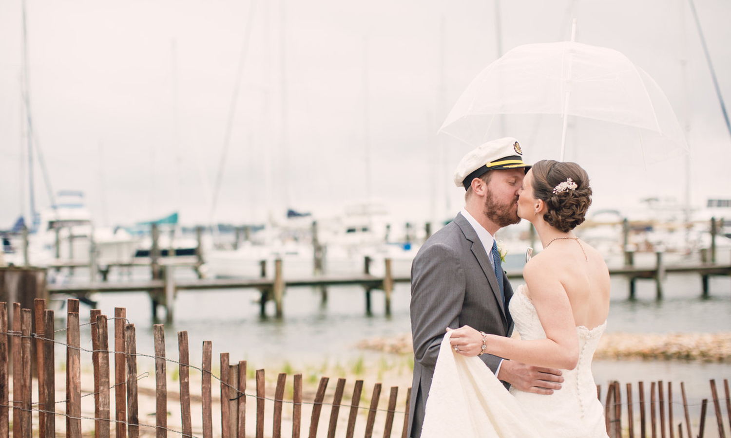A couple kissing overlooking the bay