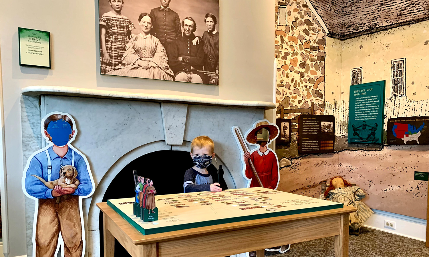A young boy playing at a table