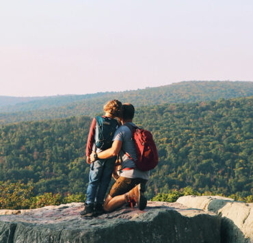 Father and son on top of cliff