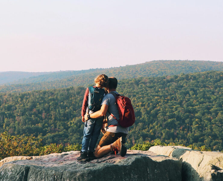 Father and son on top of cliff