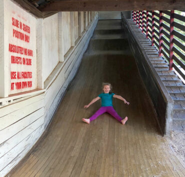 girl going down slide