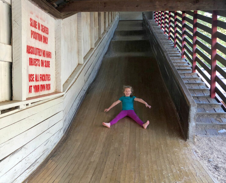 girl going down slide