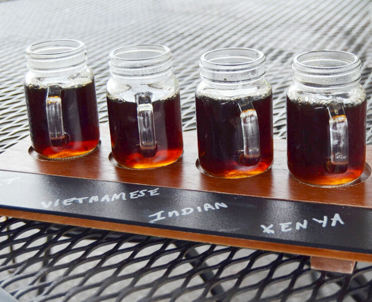 4 cups of coffee in a coffee flight