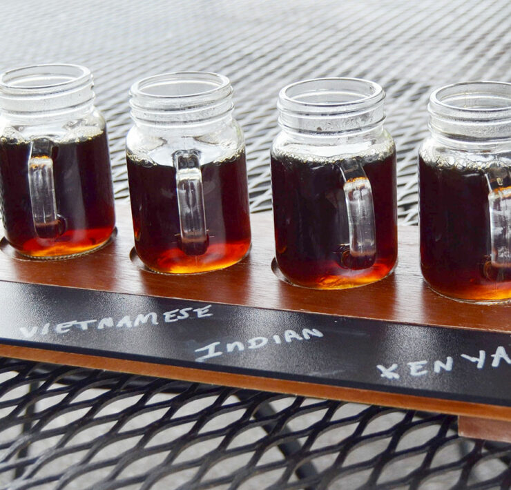 4 cups of coffee in a coffee flight