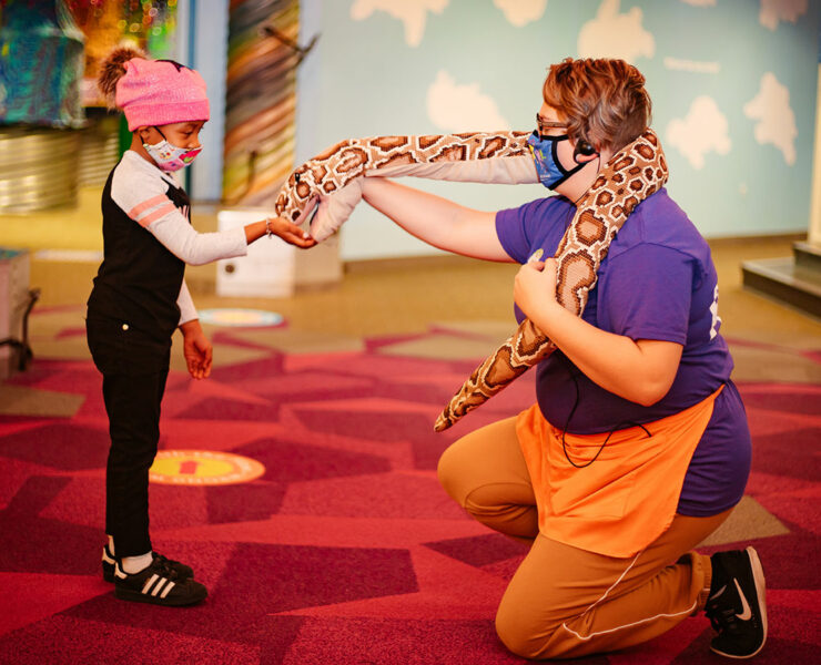 man and girl with snake