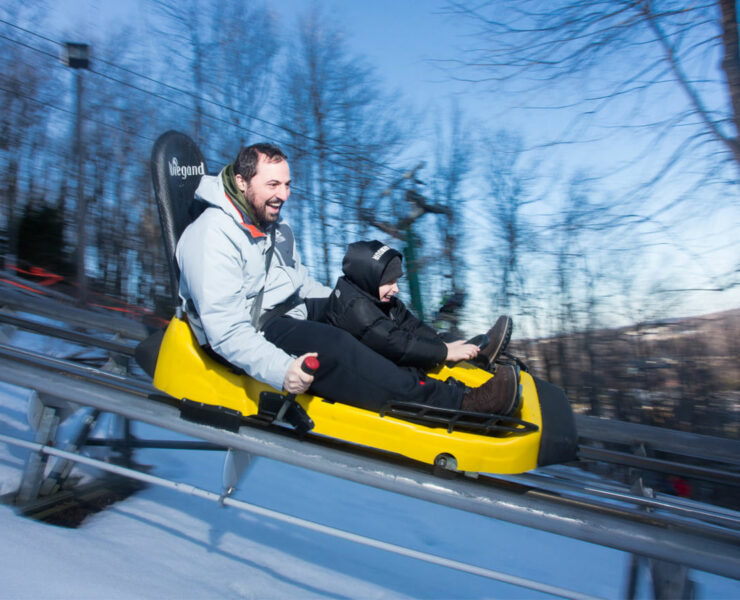 man and son on wisp mountain coaster
