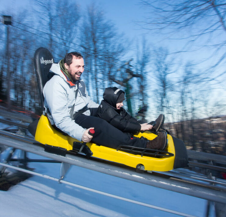 man and son on wisp mountain coaster