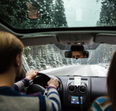 couple driving in snow