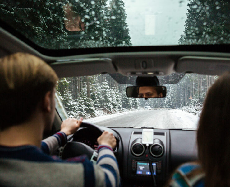 couple driving in snow