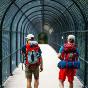 two men crossing the I-70 footbridge on the Appalachian Trail