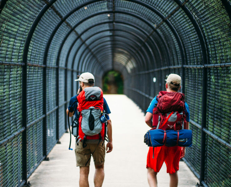 two men crossing the I-70 footbridge on the Appalachian Trail