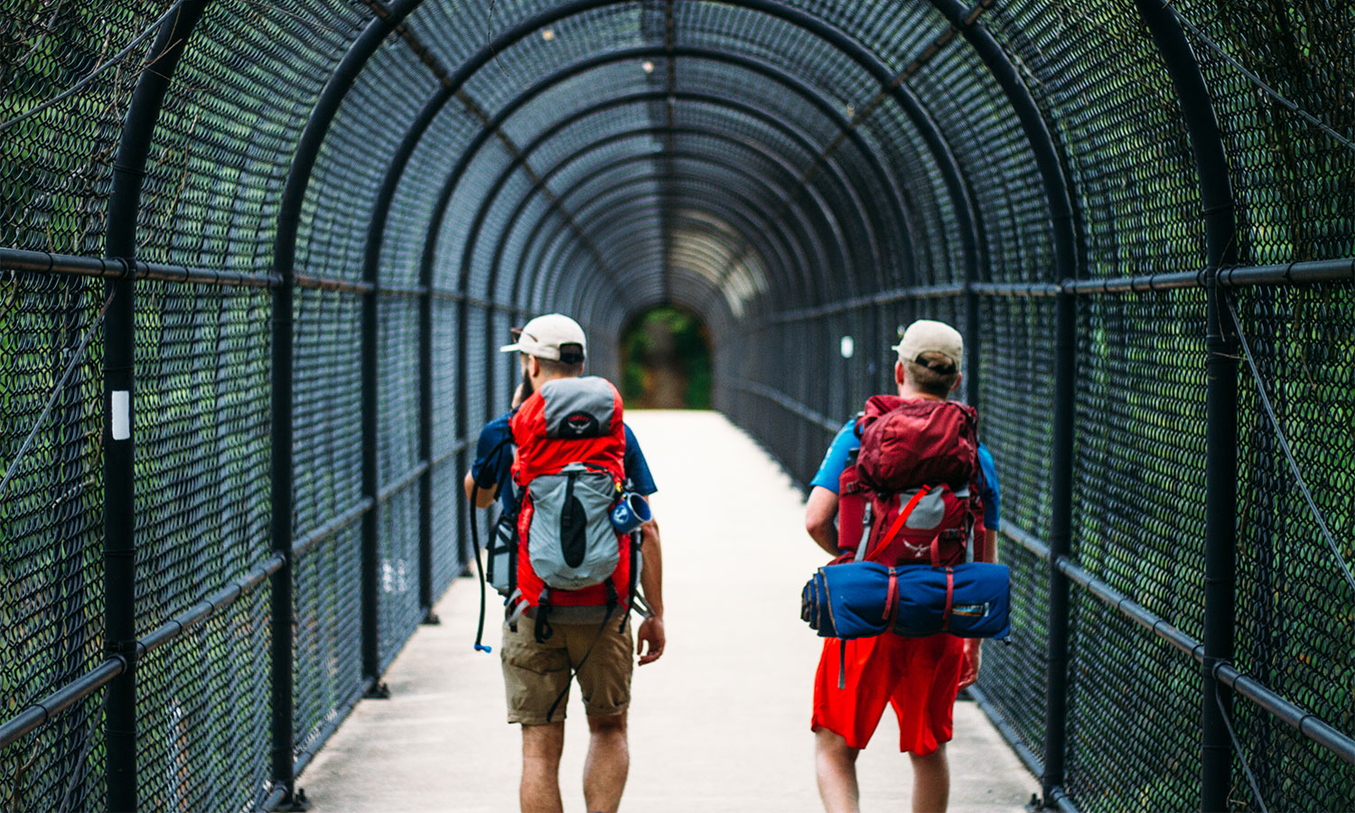 two men crossing the I-70 footbridge on the Appalachian Trail