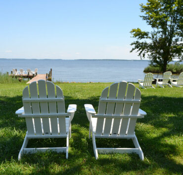 two white Adirondack chairs