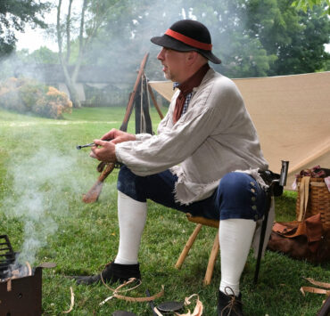 history reenactment by a fire