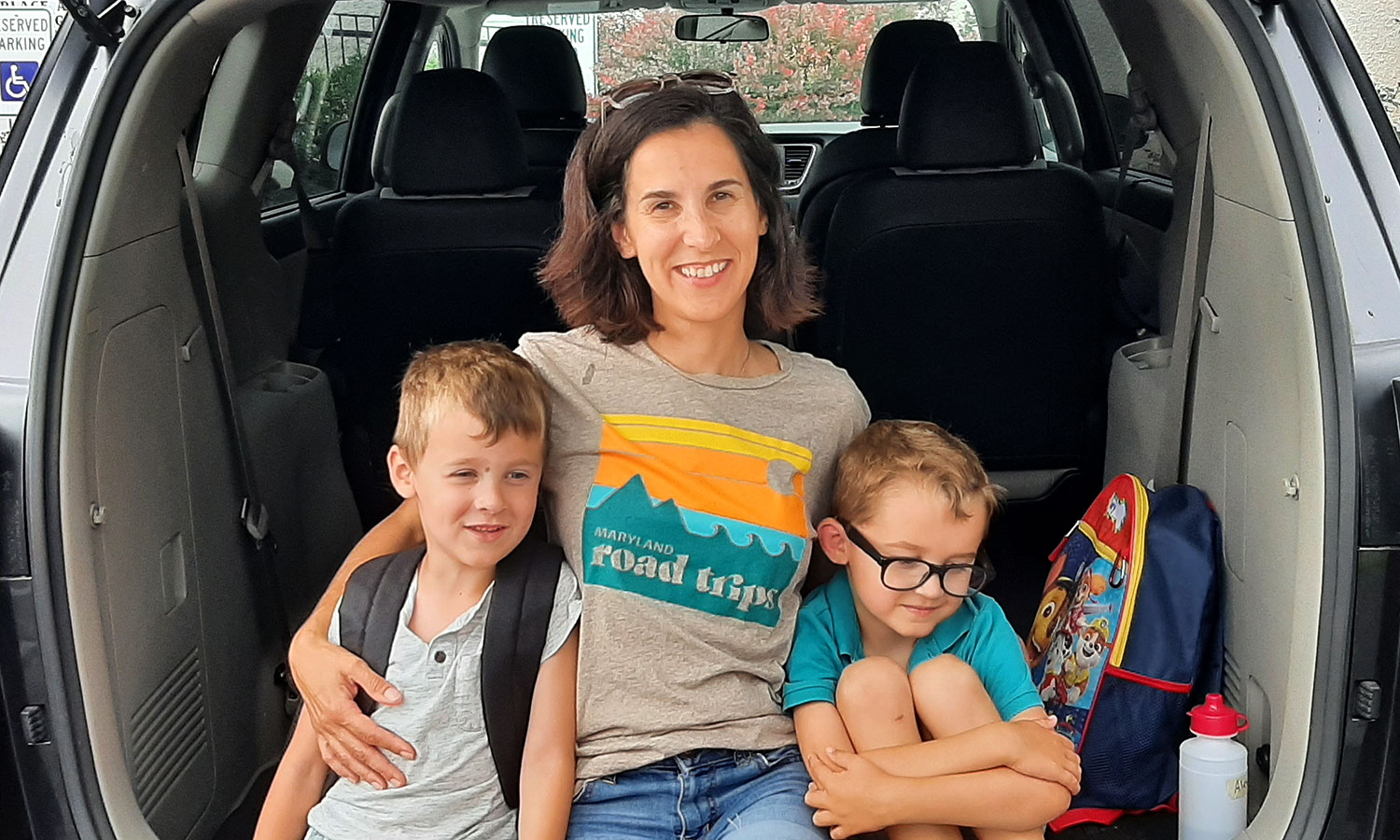 Hilary with her sons in their minivan