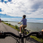 Bikers along the marsh in Assateague Island