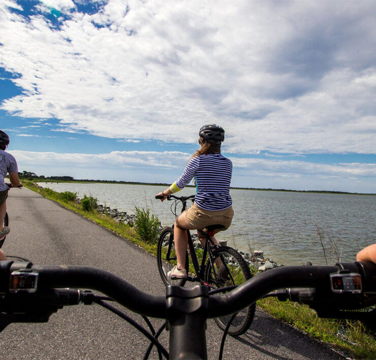 Bikers along the marsh in Assateague Island