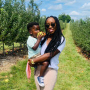 mom and son in apple orchard