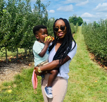 mom and son in apple orchard