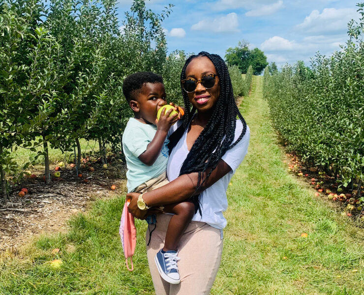 mom and son in apple orchard