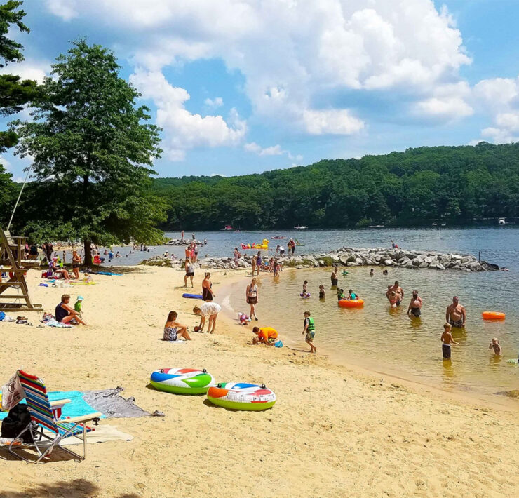 people playing on the beach at Deep Creek Lake