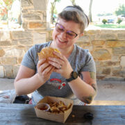 author enjoying burger