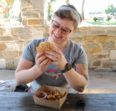author enjoying burger